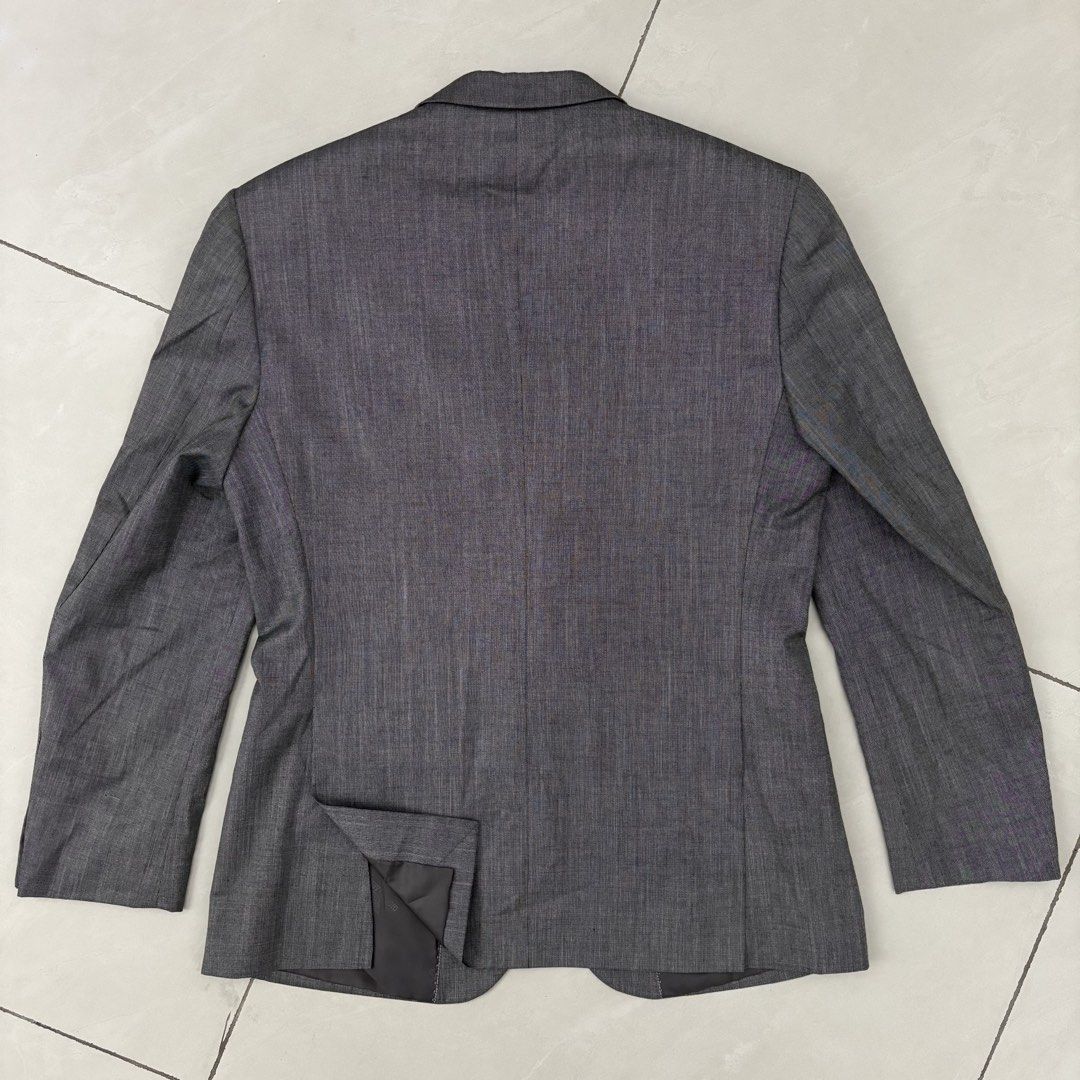 Giorgio Armani Grey Wool Blend Blazer Jacket (Category: Coats, Jackets and Outerwear) located in Cavite. Submitted by mana__ (Listing ID 1465740010, Image 3). Description: - Authentic Giorgio Armani grey blazer - Premium wool blend material - Classic tailored fit with single back vent - Two-button front closure and flap pockets - Four decorative buttons on each cuff - Branded interior lining with convenient inner pockets - Condition: Excellent / 