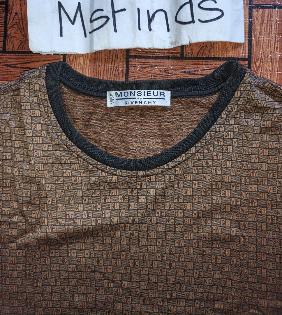 Givenchy - Men's T-Shirt Brown Monogram All-Over (Category: Tshirts & Polo Shirts ) located in Naga. Submitted by beauty_msfinds (Listing ID 1465663135, Image 2). Description: Givenchy - Men's T-Shirt Brown Monogram All-Over - Brown Givenchy T-shirt - Monogram All-over - Iconic Givenchy 4-G logo embroidered on chest - Classic crew neck Size: L on tag (can fit Large to XL) Width: 21.5 inches Length: 29 inches Color rate : 9.5/10 Excellent Conditio