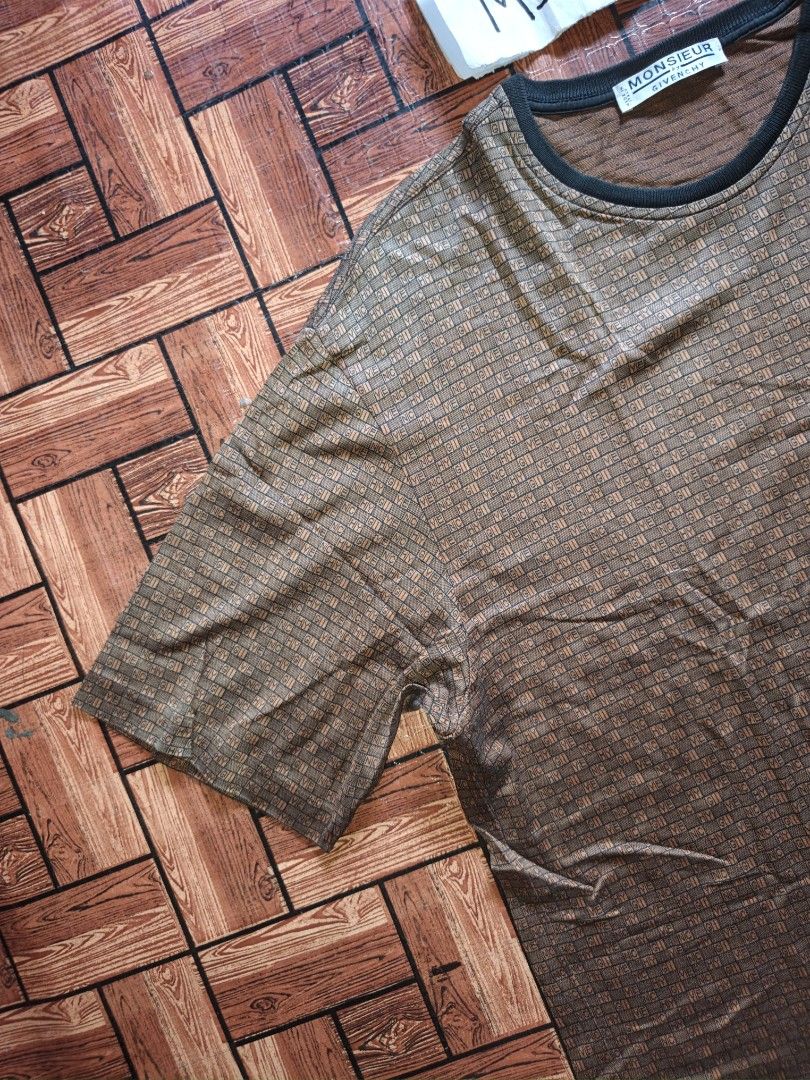 Givenchy - Men's T-Shirt Brown Monogram All-Over (Category: Tshirts & Polo Shirts ) located in Naga. Submitted by beauty_msfinds (Listing ID 1465663135, Image 3). Description: Givenchy - Men's T-Shirt Brown Monogram All-Over - Brown Givenchy T-shirt - Monogram All-over - Iconic Givenchy 4-G logo embroidered on chest - Classic crew neck Size: L on tag (can fit Large to XL) Width: 21.5 inches Length: 29 inches Color rate : 9.5/10 Excellent Conditio