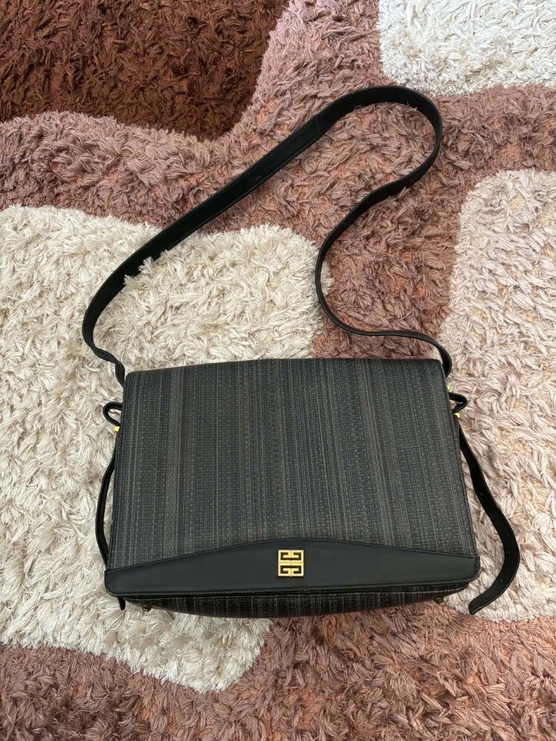 Givenchy vintage grey textured messenger shoulder bag (Category: Luxury Bags & Wallets) located in Daet. Submitted by jemotovlog28 (Listing ID 1465749396, Image 1). Description: Givenchy messenger bag in grey textured fabric and black leather trim. Flap closure with gold tone hardware and the classic Givenchy logo plate on the front. Adjustable black leather strap with gold hardware details. Deep main compartment inside. Minor wear visible on the