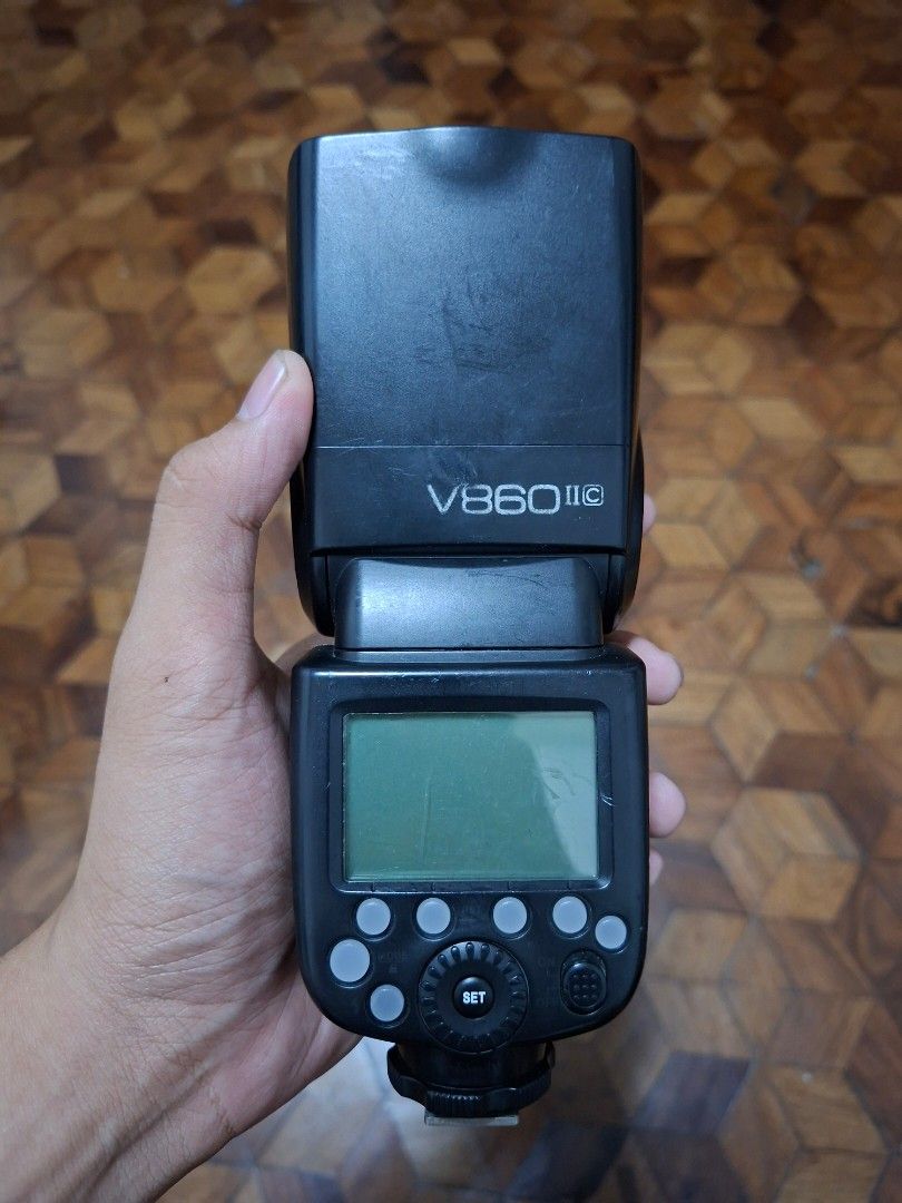 Godox V860II-C Speedlite Camera Flash (Category: Flashes) located in Santa Rosa. Submitted by spinetram53316 (Listing ID 1465677614, Image 1). Description: - Item: Godox V860IIC Flash Unit for Canon cameras - Features: Clear LCD screen with standard control dial and buttons, front red sub-flash panel - Ports: Micro USB port, sync cord jack, and wireless port on the side - Condition: Normal wear marks on the plastic body from regular shooting sess