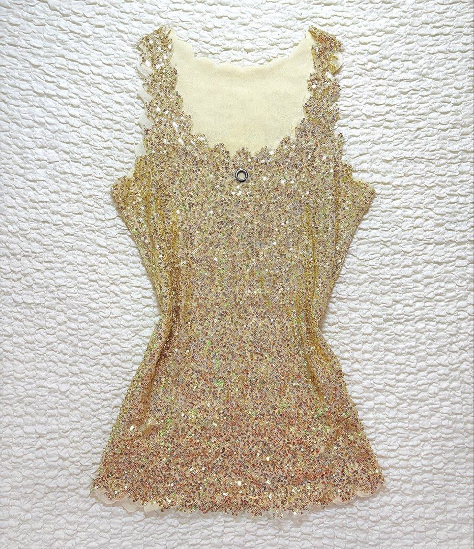 Gold sequin sleeveless (Category: Sleeveless) located in Manila. Submitted by belles.clos3t (Listing ID 1465656149, Image 1). Description: Gold sequin top with a subtle sparkle that catches the light beautifully. A fun statement piece for adding a little glam to any outfit. ✨.