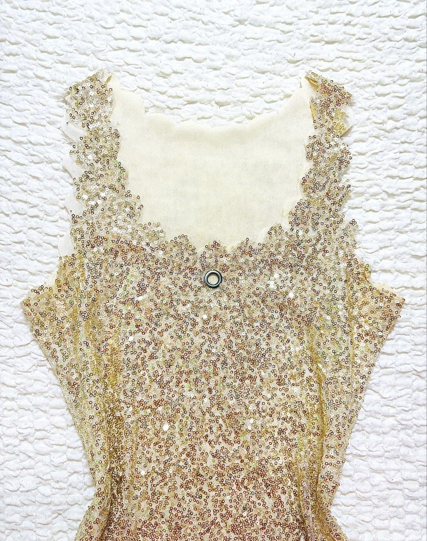 Gold sequin sleeveless (Category: Sleeveless) located in Manila. Submitted by belles.clos3t (Listing ID 1465656149, Image 2). Description: Gold sequin top with a subtle sparkle that catches the light beautifully. A fun statement piece for adding a little glam to any outfit. ✨.