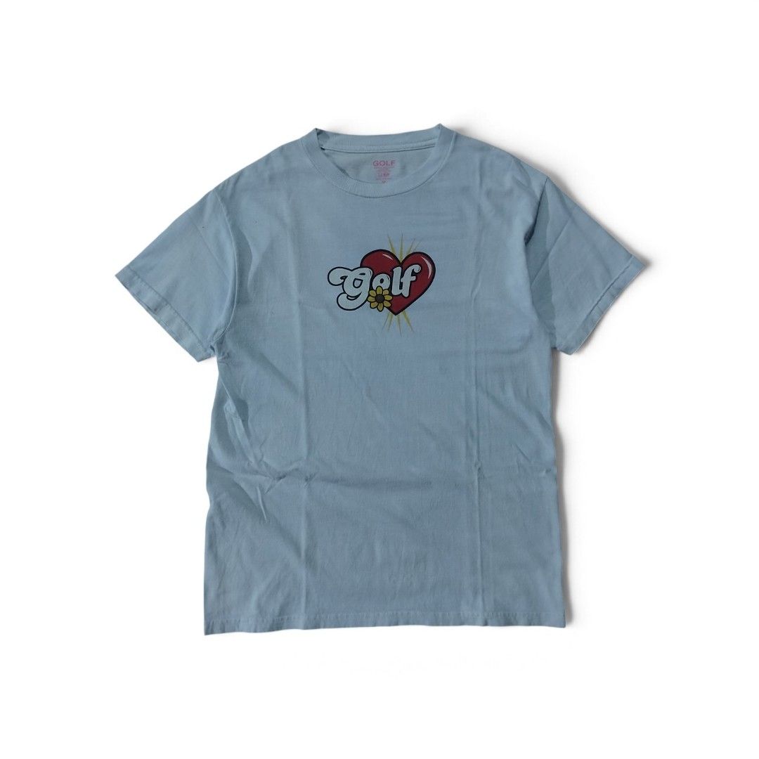 Golf Wang Heart Logo T-Shirt (Category: Tshirts & Polo Shirts ) located in Tayabas. Submitted by jthriftshop. (Listing ID 1465703221, Image 1). Description: - Brand: Golf Wang - Color: white - Size: Men's Medium (printed tag) - Design: Center chest graphic with red heart, yellow sunflower, and puffy white lettering - Details: Crew neck, short sleeves - Style: Great everyday piece for streetwear outfits.