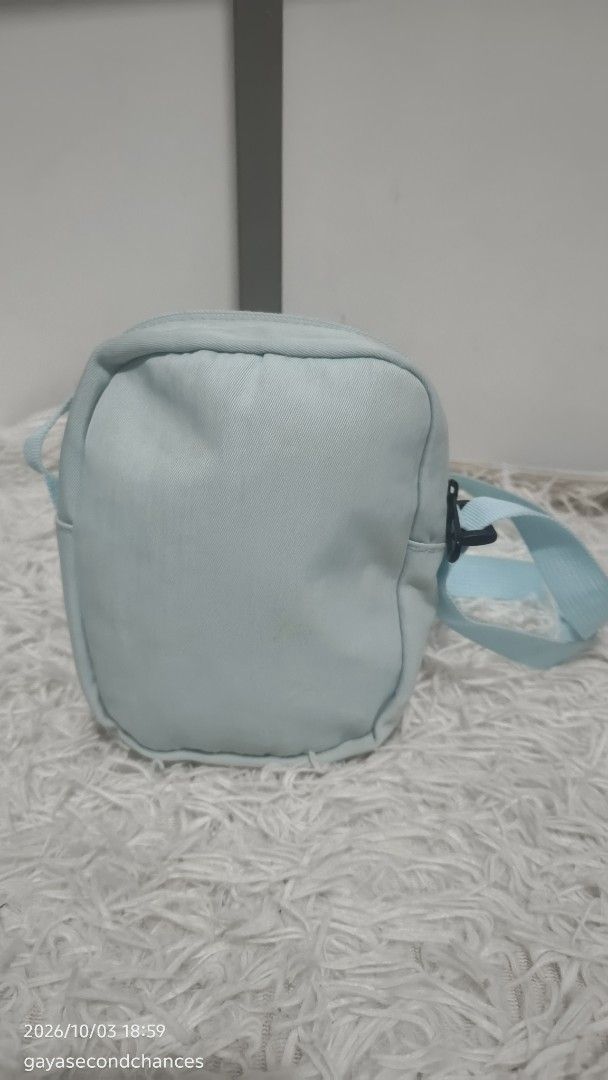 GOOSE KIDDIE LIGHT BLUE CROSS BODY BAG (Category: Cross-body Bags) located in Kalibo. Submitted by secondchances.thriftsh8p (Listing ID 1465690915, Image 3). Description: - Color: Light blue - Material: Durable fabric - Cute attached white duck plushie with orange beak and feet - Adjustable light blue shoulder strap with side-release buckle - Secure top zip closure - Compact size, perfect for everyday essentials - Brand new and ready to ship!.