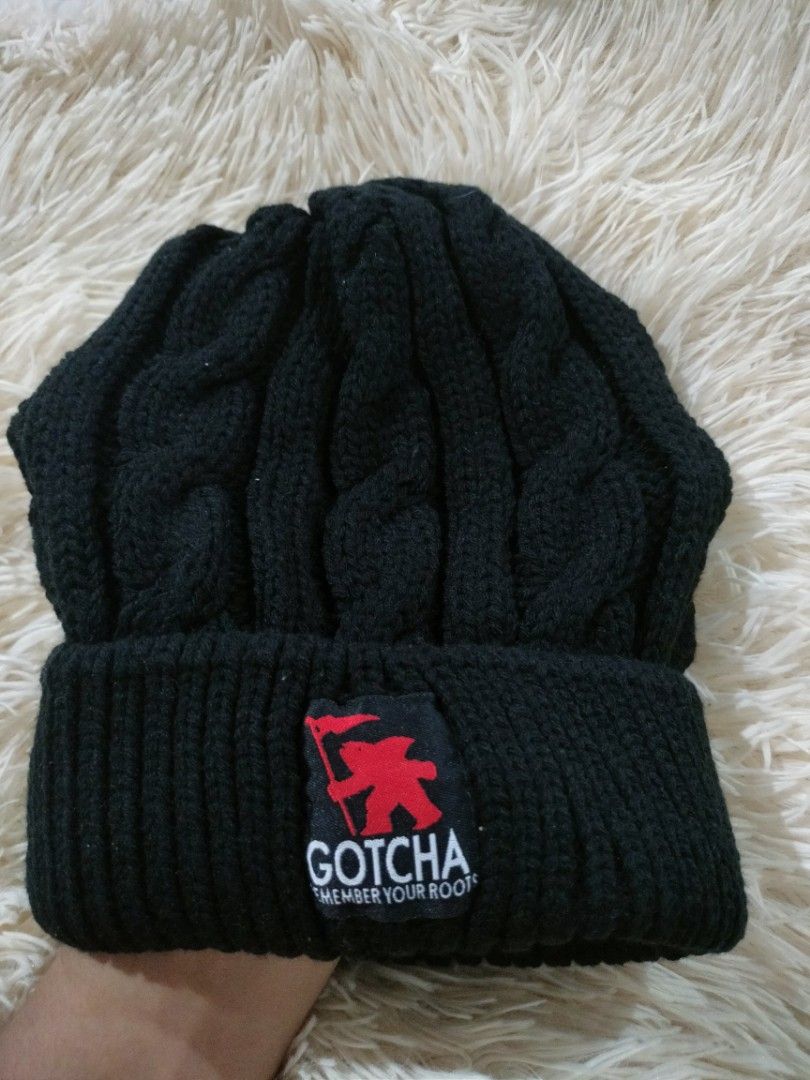 Gotcha Black Cable Knit Beanie (Category: Beanies) located in Abucay. Submitted by naixrazion199x (Listing ID 1465709421, Image 1). Description: - Brand: Gotcha - Color: Black - Style: Cable knit beanie with front fold and embroidered logo patch - Size: One size fits all - Material: 100% acrylic - Condition: Brand new with original tags attached.