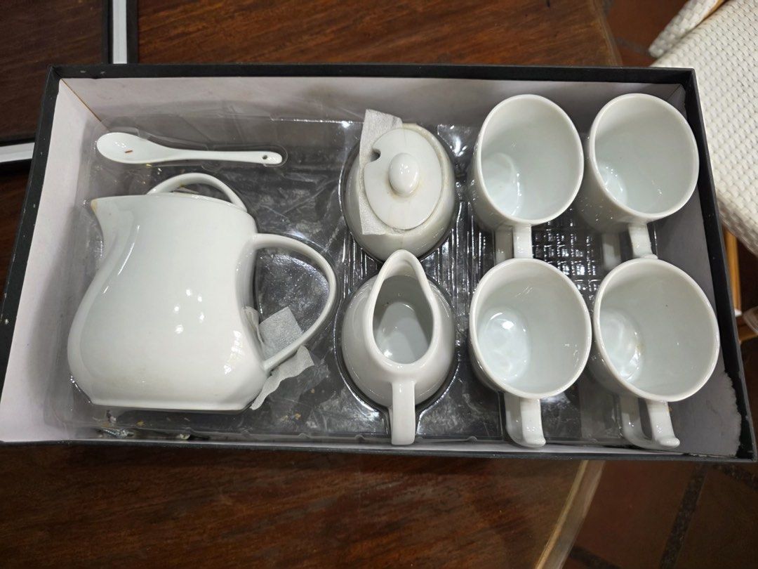 Gourdo's White Ceramic Tea Set With Cups And Pot (Category: Coffee & Tea Tableware) located in Paranaque City. Submitted by stamford.woodleigh (Listing ID 1465628756, Image 2). Description: - Complete white ceramic tea set from Gourdo's - Clean minimalist design with a classic white gloss finish - Includes 1 teapot with lid, 4 matching mugs, 1 creamer pitcher, 1 sugar bowl with lid, and 1 small spoon - Original fitted box included for safe storag