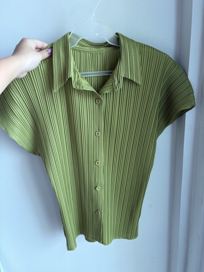 Green Pleated Short Sleeve Button-Down Top (Category: Blouses) located in Paranaque City. Submitted by mary_jj (Listing ID 1465652621, Image 1). Description: - fits xs-m (vv stretchy) - In the cutest matcha color. giving issey miyake .
