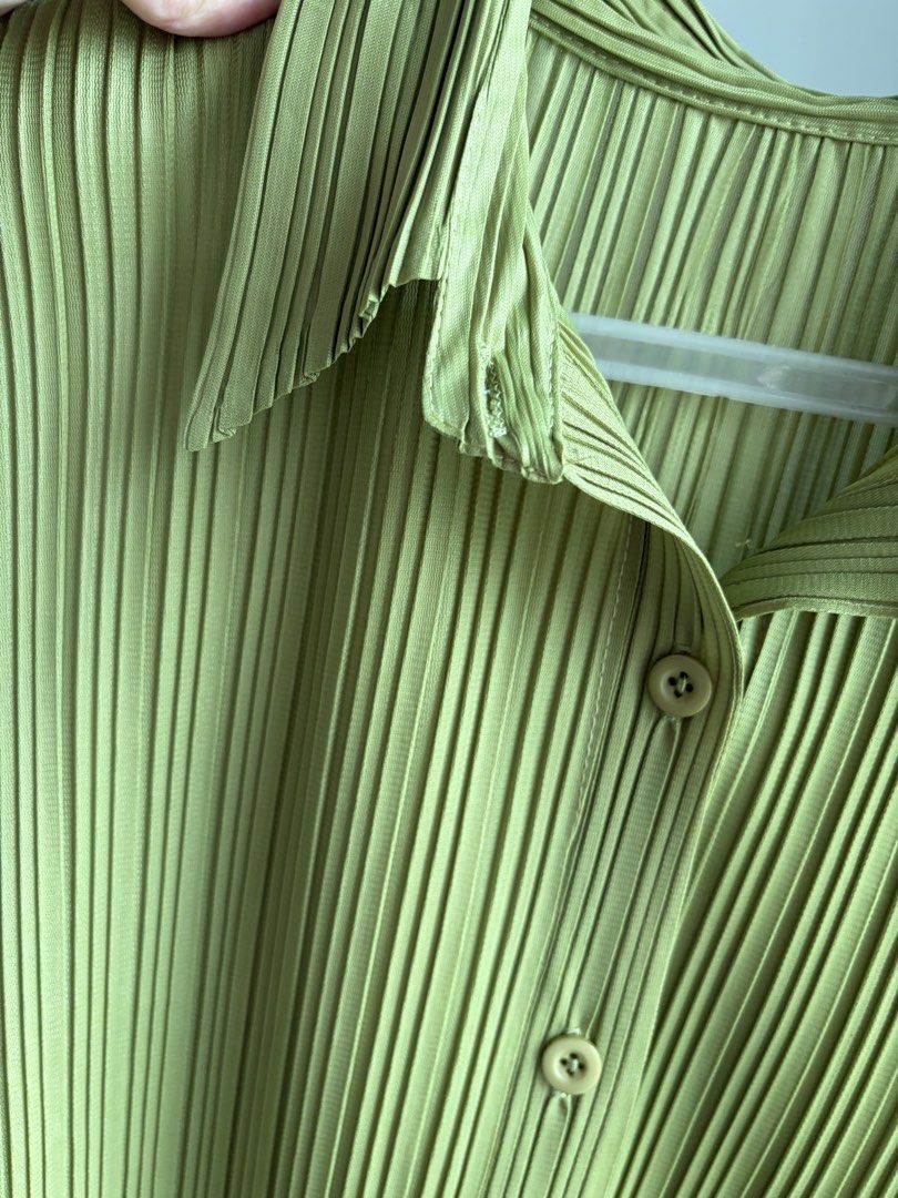 Green Pleated Short Sleeve Button-Down Top (Category: Blouses) located in Paranaque City. Submitted by mary_jj (Listing ID 1465652621, Image 3). Description: - fits xs-m (vv stretchy) - In the cutest matcha color. giving issey miyake .