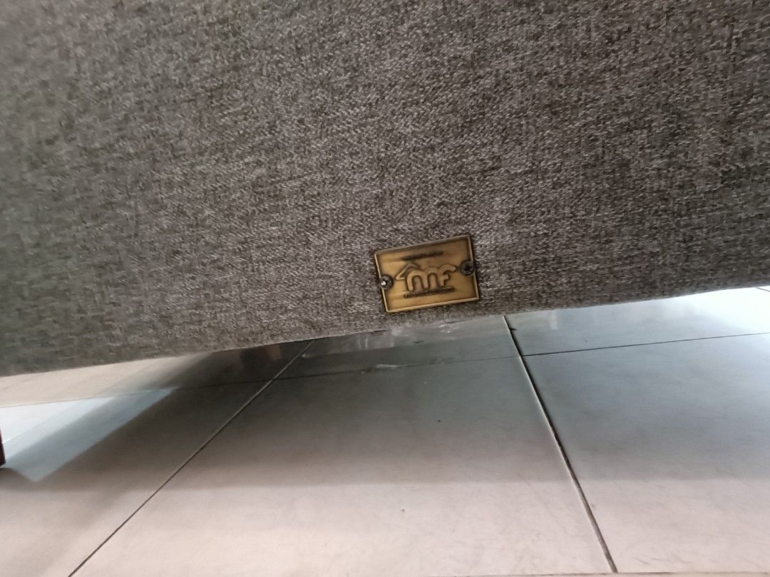 Grey Fabric Sofa Mandaue Foam (Category: Sofas) located in Las Pinas. Submitted by jenny.nogu (Listing ID 1465702642, Image 2). Description: - Mandaue Foam Sofa - No lubog, no lundo, no punit - Style: Modern grey fabric sofa with a chic tufted back - Comfort: Includes two matching bolster pillows for extra support and style - Durability: Supported by sturdy wooden legs underneath - Versatility: Neutral color effortlessly matches any home interior