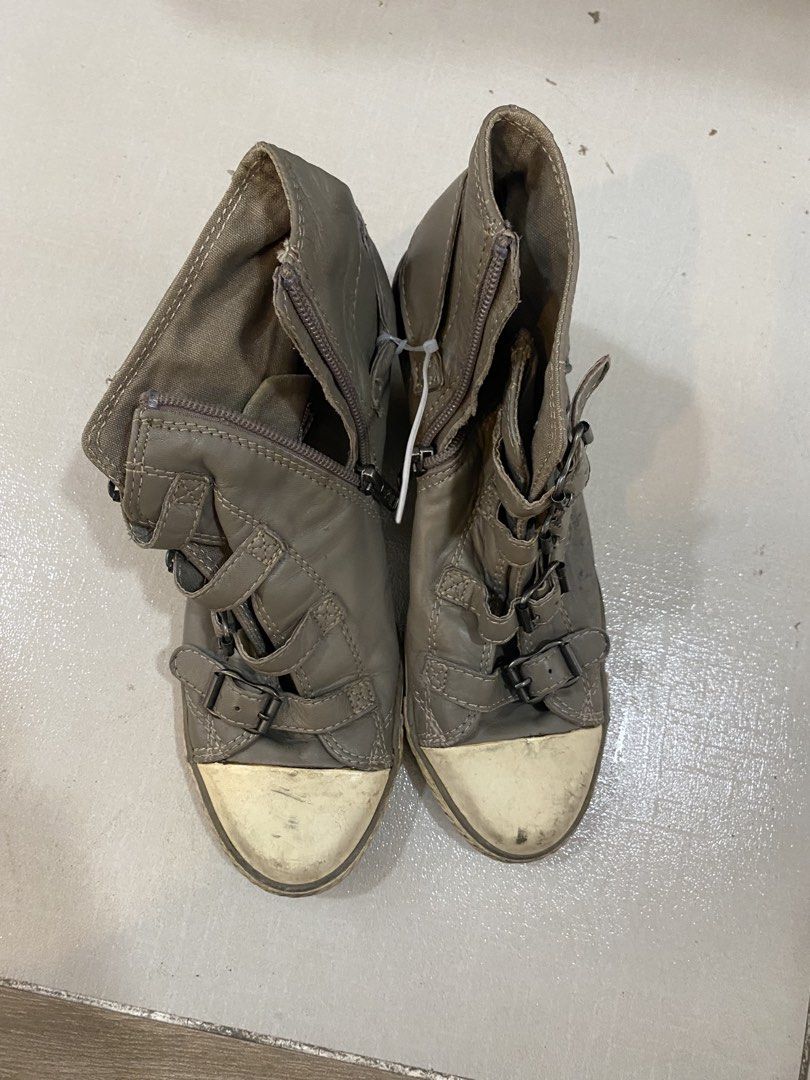 Grey Wedge Sneaker Boots with Buckles (Category: Boots) located in Alburquerque. Submitted by zanegavynn43872 (Listing ID 1465586245, Image 1). Description: - Item: Grey wedge sneaker boots - Size: 38 (marked on inner sole) - Features: Multiple strap and buckle details with convenient side zipper closure - Design: Wedge heel with contrasting white rubber toe caps - Condition: Worn condition with visible dirt marks and scuffs on soles and toes.