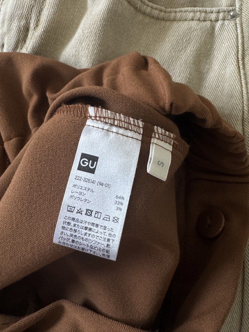 GU Brown Wrap Skirt (Category: Skirts) located in Pasig City. Submitted by kutleyn (Listing ID 1465697228, Image 2). Description: - Brand/Model: GU Wrap Skirt - Size: S - Color: Brown - Length: Midi - Design: Asymmetrical overlap front with a right-hip pocket - Material: 64% polyester, 33% rayon, 3% polyurethane (smooth with slight stretch) - Condition: Clean tag and buttons intact.