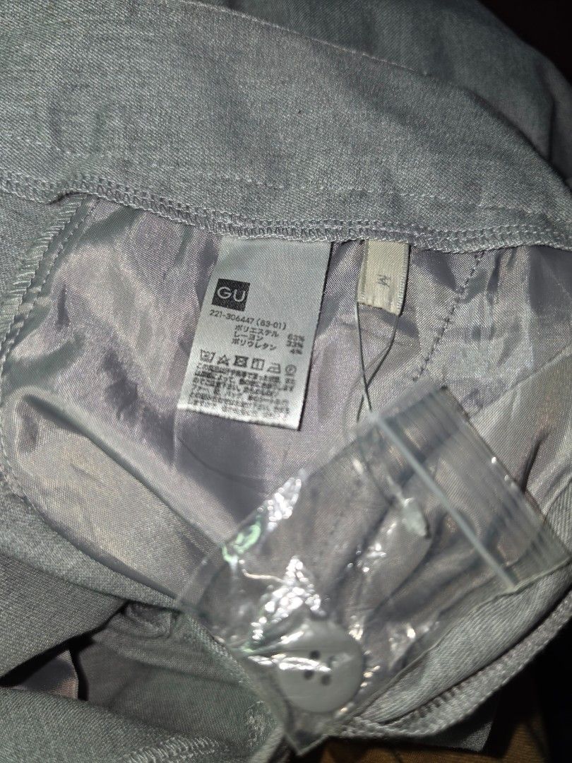GU Grey Trousers Size M (Category: Other Bottoms) located in Manila. Submitted by _sj1204 (Listing ID 1465619539, Image 2). Description: - Brand: GU - Size: M (Brand new with tags attached) - Material: Polyester, rayon, and polyurethane blend - Fit: Straight cut leg design - Style: Ideal for work or smart casual wear - Extras: Includes extra spare button in a small pouch - Condition: with washable stain / Never been used - Waistline: 26-28 inches