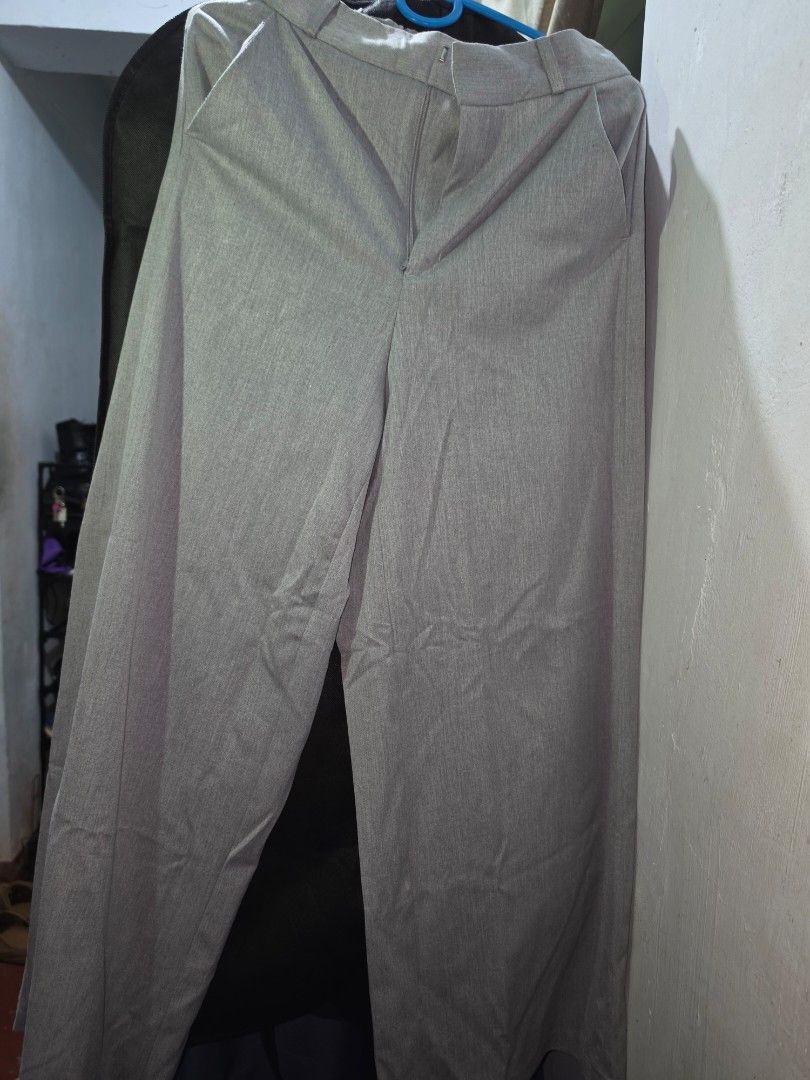 GU Grey Trousers Size M (Category: Other Bottoms) located in Manila. Submitted by _sj1204 (Listing ID 1465619539, Image 1). Description: - Brand: GU - Size: M (Brand new with tags attached) - Material: Polyester, rayon, and polyurethane blend - Fit: Straight cut leg design - Style: Ideal for work or smart casual wear - Extras: Includes extra spare button in a small pouch - Condition: with washable stain / Never been used - Waistline: 26-28 inches
