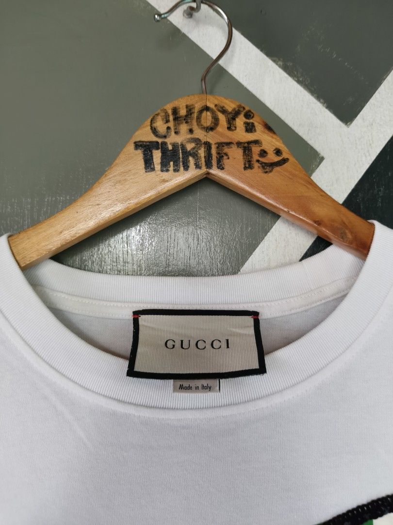 Gucci Apple Sequins White T-Shirt Size M (Category: Shirts) located in Manila. Submitted by choycleverdeer.f04b80 (Listing ID 1465632806, Image 2). Description: - Authentic Gucci white cotton t-shirt - Eye-catching large sequin apple graphic on the front with Double G logo - Classic crew neckline and short sleeves - Size: M (tag attached near the collar) - Includes Gucci neck label and Made in Italy tag - Pristine white fabric with all sequin det