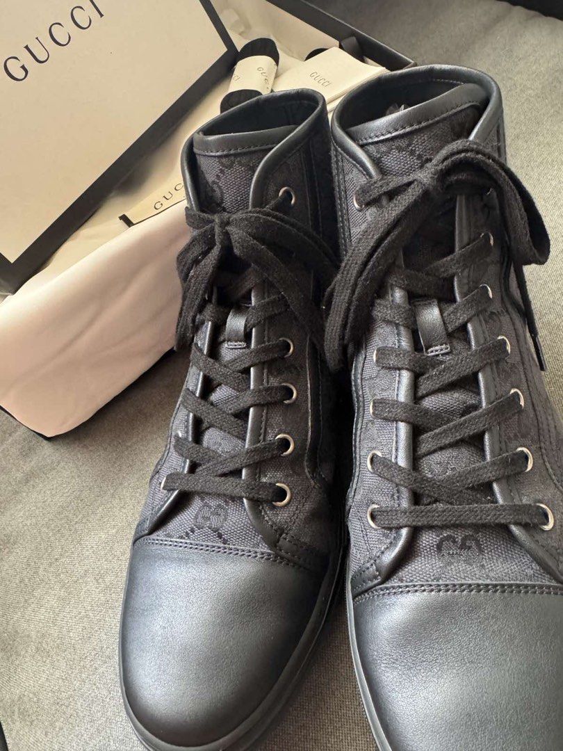 Gucci Black GG Monogram High-Top Sneakers (Category: Sneakers & Footwear) located in Manila. Submitted by carolynba49610 (Listing ID 1465604965, Image 1). Description: Gucci high-top sneakers in black GG monogram canvas and leather trim. Classic lace-up front with metal eyelets. Textured rubber sole with debossed Gucci script underneath. Includes the original branded box, dust bag, spare black laces, and care booklet. Clean condition overall, rea