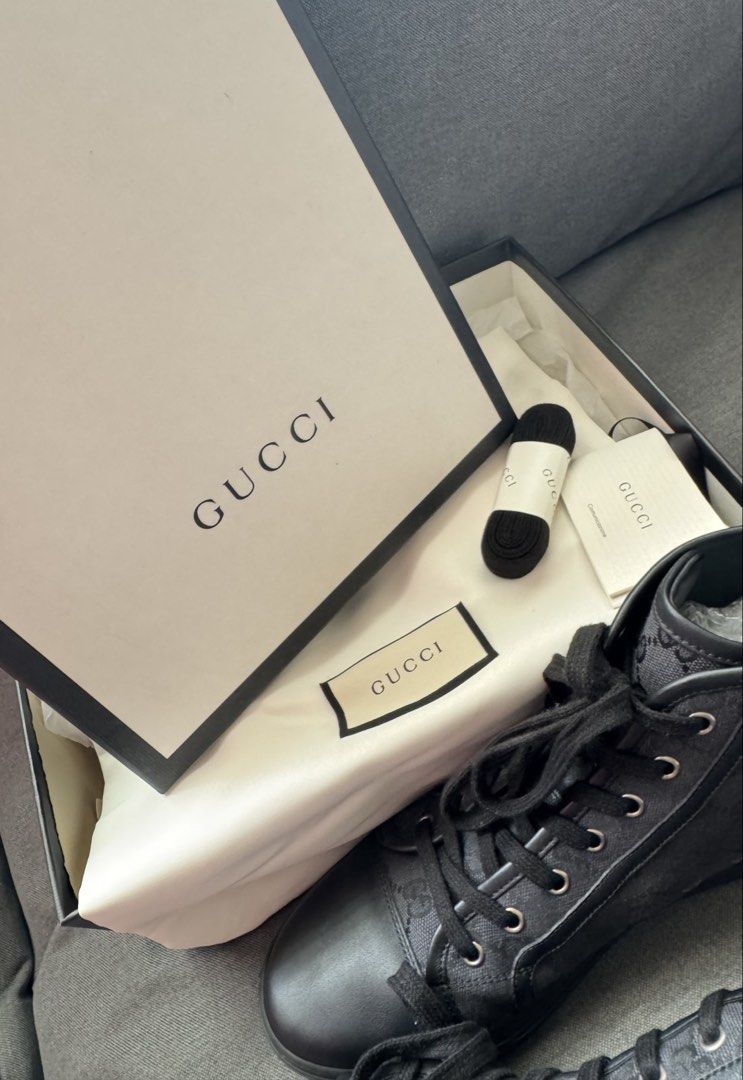 Gucci Black GG Monogram High-Top Sneakers (Category: Sneakers & Footwear) located in Manila. Submitted by carolynba49610 (Listing ID 1465604965, Image 2). Description: Gucci high-top sneakers in black GG monogram canvas and leather trim. Classic lace-up front with metal eyelets. Textured rubber sole with debossed Gucci script underneath. Includes the original branded box, dust bag, spare black laces, and care booklet. Clean condition overall, rea