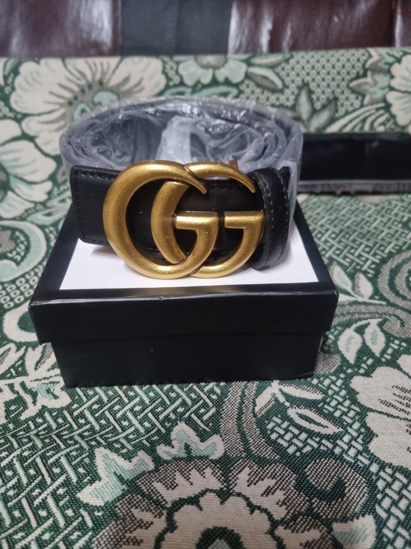 Gucci Double G Black Leather Belt (Category: Belts) located in Manila. Submitted by monya111 (Listing ID 1465601099, Image 1). Description: - Premium black leather belt featuring iconic gold-tone double G metal buckle - Classic width strap with clean edge stitching - Pristine hardware with a brushed finish - Comes complete with original black and white branded presentation box.