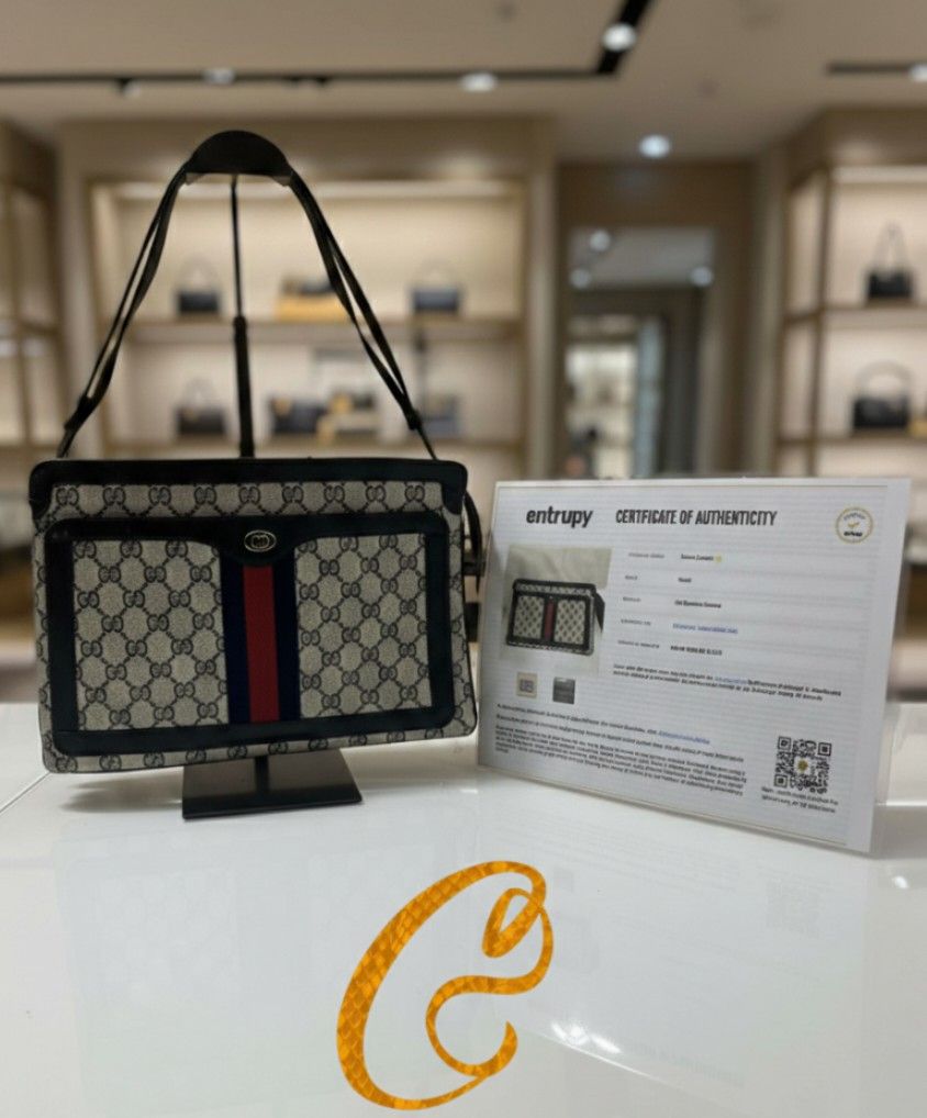 Gucci GG Supreme Canvas Shoulder Bag (Category: Luxury Bags & Wallets) located in Quezon City. Submitted by candysugar.collections (Listing ID 1465702059, Image 1). Description: - Authentic Gucci shoulder bag in classic GG Supreme canvas - Features iconic red and blue web stripe with gold-tone emblem - Durable dark leather trim and comfortable double shoulder straps - Includes Entrupy certificate of authenticity.