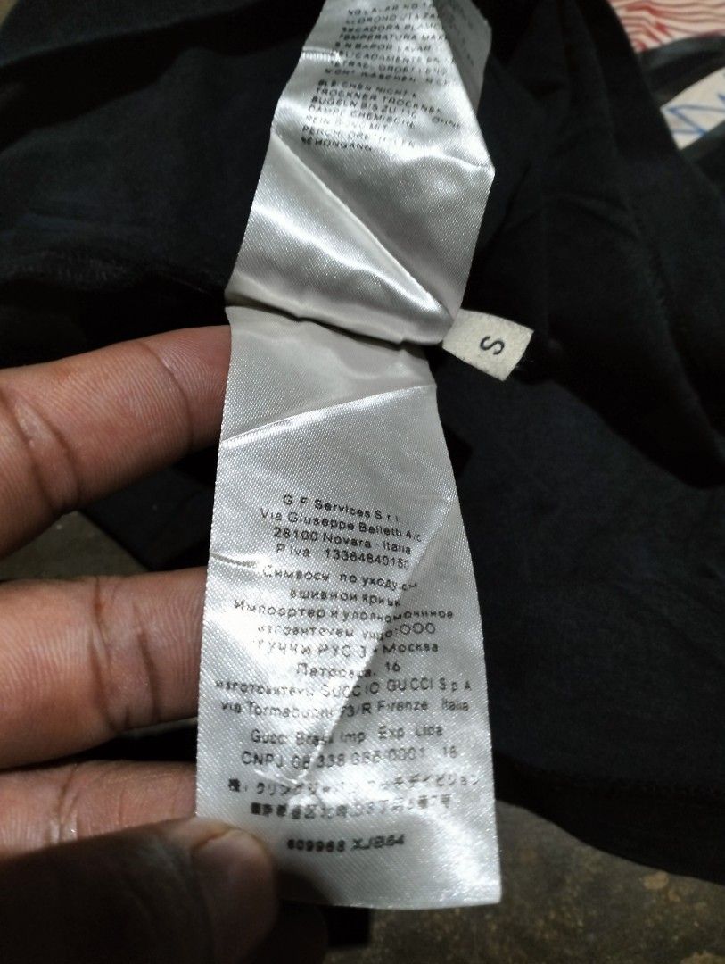GUCCI GRAFFIC SHIRT (Category: Luxury Apparel) located in Solana. Submitted by allgoodst.s (Listing ID 1465714678, Image 3). Description: GUCCI GRAFFIC SHIRT CAT DESIGN GOOD CONDITION MEDIUM TO large 9/10 CR MISSING NECK TAG, INTACK WASH TAGS hairline crack.