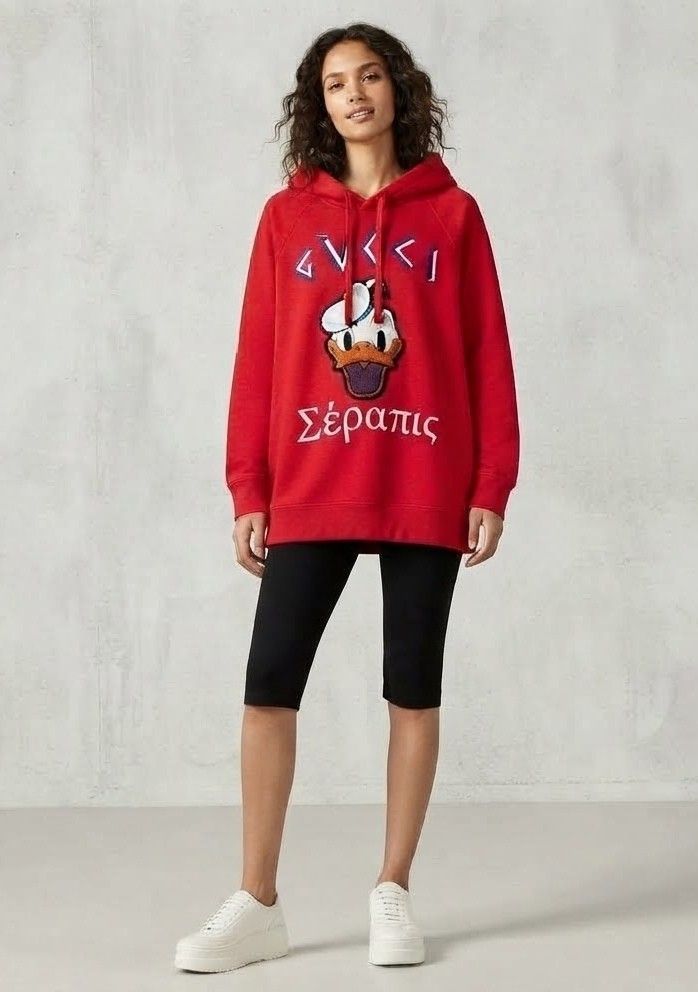 Gucci x Disney Distressed (Category: Others Tops) located in Iba. Submitted by selector_items (Listing ID 1465642042, Image 2). Description: *Gucci x Disney "Distressed" Donald Duck Hoodie* from the 2020 Pre-Fall Collection 🔥 ### *What makes it "distressed":* 1. *Design intent* - Gucci intentionally made this with a worn/vintage effect. That slight fraying near the hood drawstring and the textured chenille patch are part of the look. 2. *Chenill