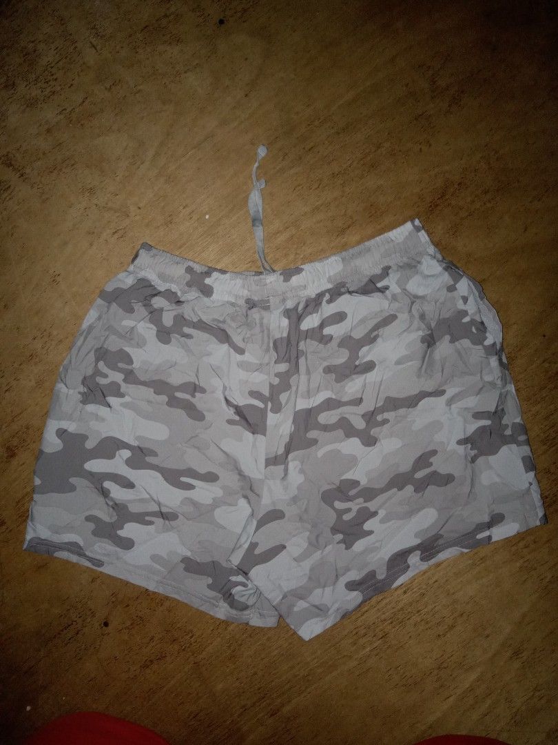 Gymshark Grey Camo Shorts Medium (Category: Shorts) located in Dumaguete. Submitted by alayon.thrifter (Listing ID 1465677761, Image 2). Description: - Brand: Gymshark - Style: Grey camo shorts - Size: Medium (Made in Cambodia) - 30 to 34 waistline - 15 length - Fit: Elastic waistband with adjustable drawstring - Details: Gymshark logo near bottom hem, wash care label attached - Condition: Great for workouts or lounging.