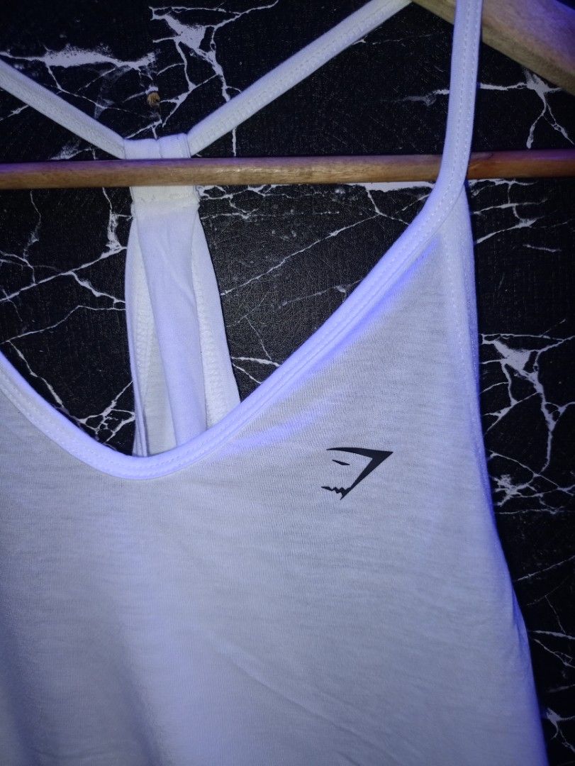 Gymshark White Racerback Workout Tank Top Size M (Category: Activewear) located in Manila. Submitted by naixhrift (Listing ID 1465626480, Image 3). Description: Gymshark Racerback Tanktop For Women Size Medium Length 23 width 21 750 plus ship jnt courier payment on gcash manila area .