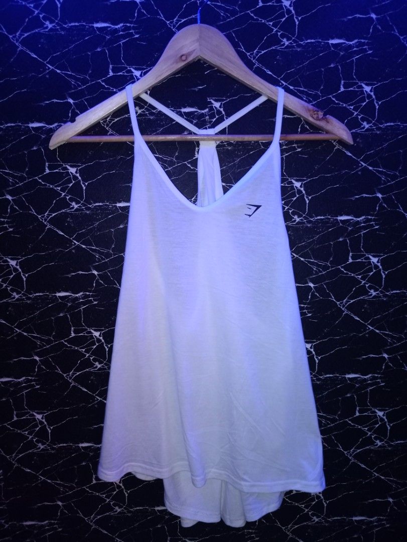 Gymshark White Racerback Workout Tank Top Size M (Category: Activewear) located in Manila. Submitted by naixhrift (Listing ID 1465626480, Image 1). Description: Gymshark Racerback Tanktop For Women Size Medium Length 23 width 21 750 plus ship jnt courier payment on gcash manila area .