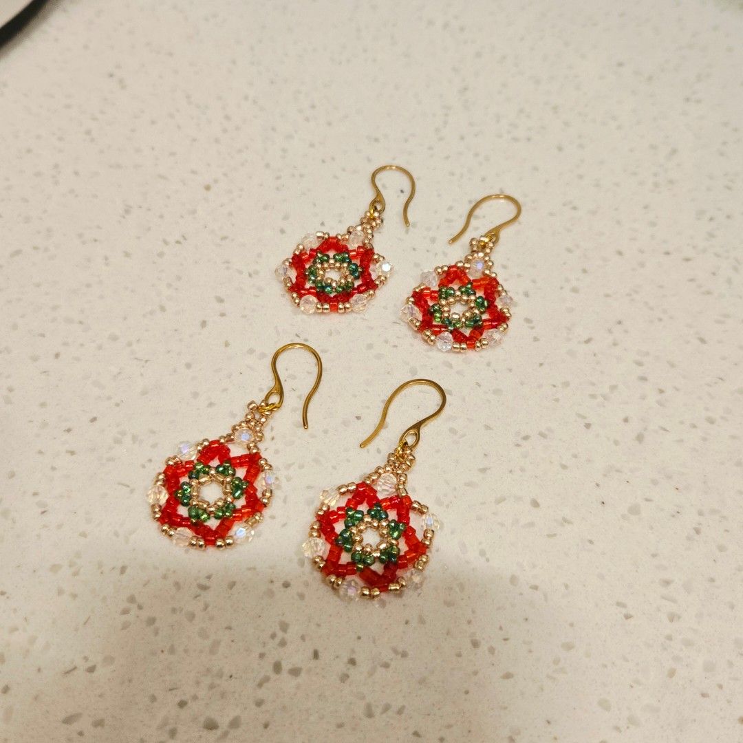 Handmade Beaded Christmas Parol Dangling Earrings (Category: Earrings) located in Mandaluyong City. Submitted by kyeoptayeppeuda (Listing ID 1465627182, Image 1). Description: - Handmade festive holiday parol design - Features vibrant red, green, gold, and clear crystal seed beads - Lightweight and comfortable for all-day wear - Equipped with gold-toned hook earwires - Perfect accessory for holiday parties and winter styling -For Preorders, pleas