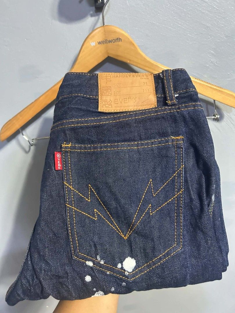 Hardly Ever's Denim Paint Splatter Jeans Size 31 (Category: Jeans) located in Manila. Submitted by marjoriete27817 (Listing ID 1465723282, Image 1). Description: - Brand: Hardly Ever - Style: Dark wash denim jeans with heavy distressing - Size: 31 (leather waist patch) - Details: All-over white paint splatter effect from front to back - Back Pockets: Unique lightning bolt stitching pattern with red tab detail - Closure: Button fly with custom met