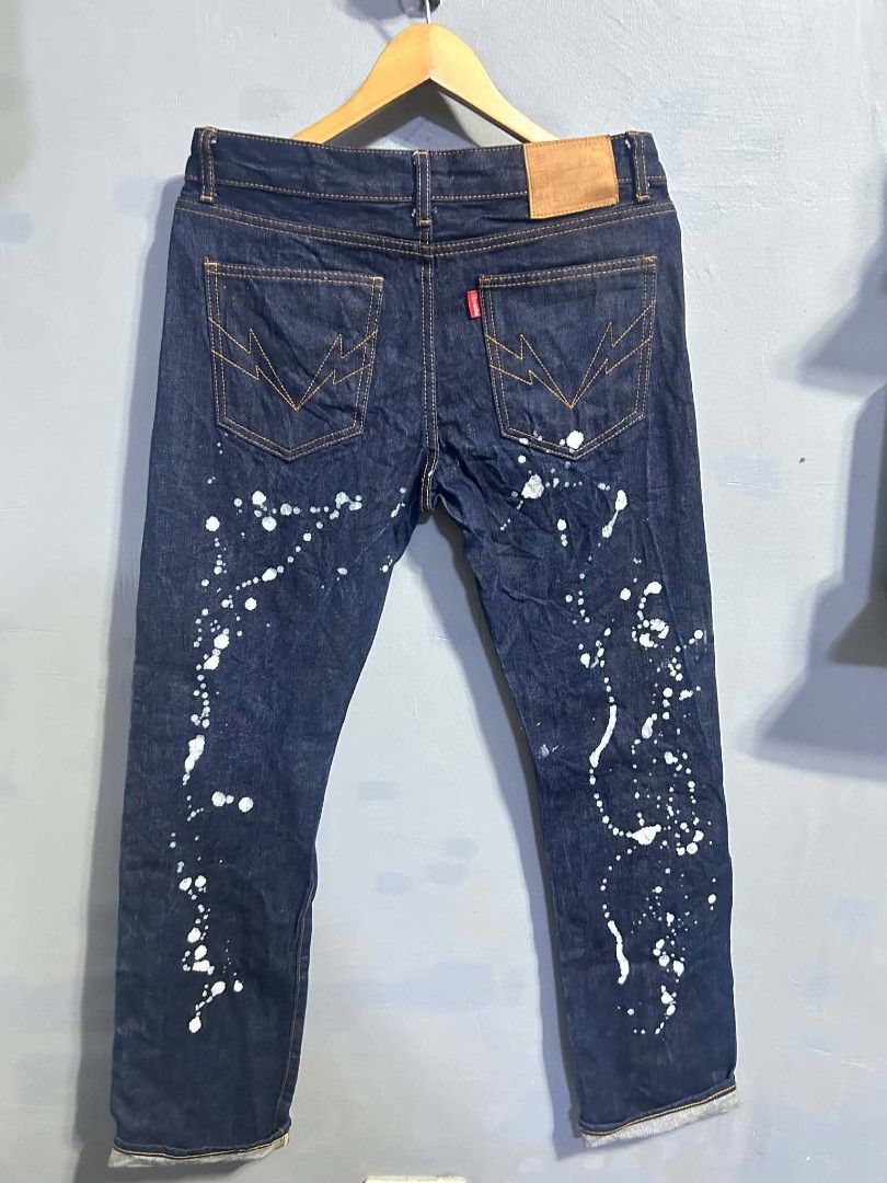 Hardly Ever's Denim Paint Splatter Jeans Size 31 (Category: Jeans) located in Manila. Submitted by marjoriete27817 (Listing ID 1465723282, Image 3). Description: - Brand: Hardly Ever - Style: Dark wash denim jeans with heavy distressing - Size: 31 (leather waist patch) - Details: All-over white paint splatter effect from front to back - Back Pockets: Unique lightning bolt stitching pattern with red tab detail - Closure: Button fly with custom met