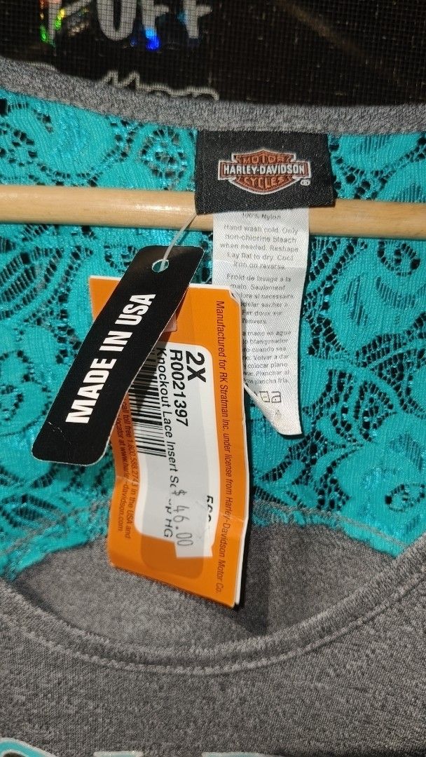 Harley-Davidson Knockout Lace Insert Scoop HG 2X (Category: Tshirts & Polo Shirts ) located in Manila. Submitted by moneyroll420 (Listing ID 1465749608, Image 1). Description: - Brand: Harley-Davidson (Official Licensed Product) - Style: Knockout Lace Insert Shirt - Size: 2X - Color: Gray body with bright turquoise lace insert at the back - Condition: Brand new with original store tags attached ($46.00 price tag) - Origin: Made in USA.