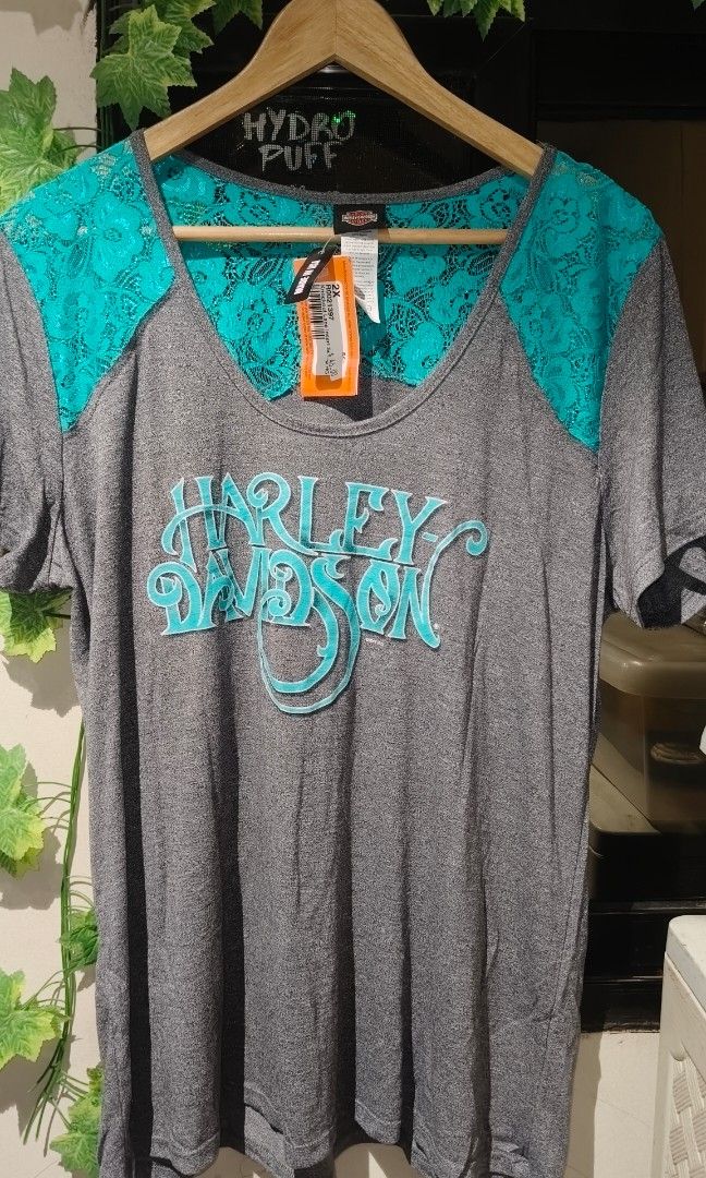 Harley-Davidson Knockout Lace Insert Scoop HG 2X (Category: Tshirts & Polo Shirts ) located in Manila. Submitted by moneyroll420 (Listing ID 1465749608, Image 2). Description: - Brand: Harley-Davidson (Official Licensed Product) - Style: Knockout Lace Insert Shirt - Size: 2X - Color: Gray body with bright turquoise lace insert at the back - Condition: Brand new with original store tags attached ($46.00 price tag) - Origin: Made in USA.