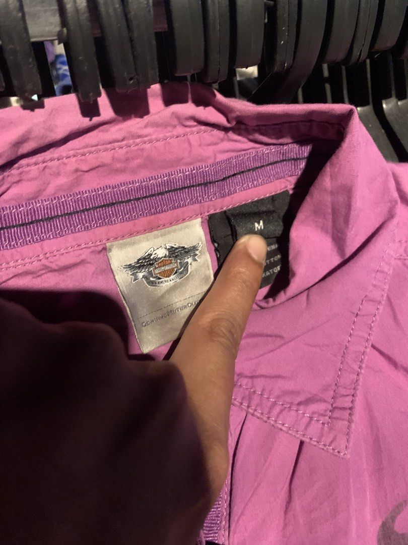 Harley-Davidson Purple Short Sleeve Button Down Shirt (Category: Tshirts & Polo Shirts ) located in Naga. Submitted by than09070539101 (Listing ID 1465748692, Image 3). Description: - Brand: Harley-Davidson - Style: Short sleeve button-down shirt - Size: Medium (collar tag attached) - Color: Purple - Details: Front chest pockets with button closures, sparkling rhinestone accent buttons - Back Design: Large iconic Harley-Davidson motorcycles graph