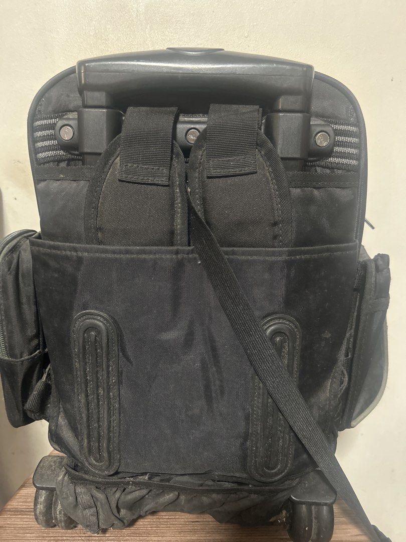 Hawk Rolling Backpack with Rain Cover (Category: Backpacks) located in Manila. Submitted by thrift_items_need (Listing ID 1465621524, Image 3). Description: - Brand: Hawk - Color: Black - Type: Roller backpack with telescoping handle and smooth-rolling wheels - Features: Multiple compartments, front pockets, and tuck-away back straps for versatility - Freebie: Matching silver rain cover with Hawk logo included - Condition: Used, with minor dust o