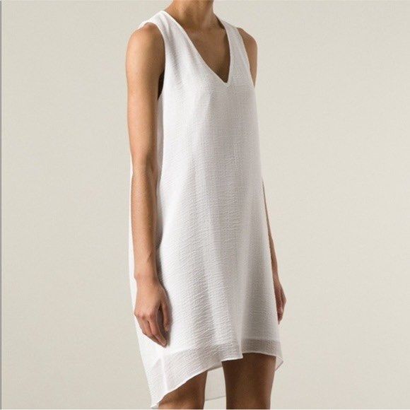 Helmut Lang Vneck Dress (Category: Luxury Apparel) located in Quezon City. Submitted by rebirthalley (Listing ID 1465642715, Image 1). Description: This is a sleeveless white Helmut Lang V-neck dress featuring a textured, lightweight overlay and a curved, uneven hem. Width-18 Length-33 Shoulder-12 Hem-19 Excellent Condition Need wash only.