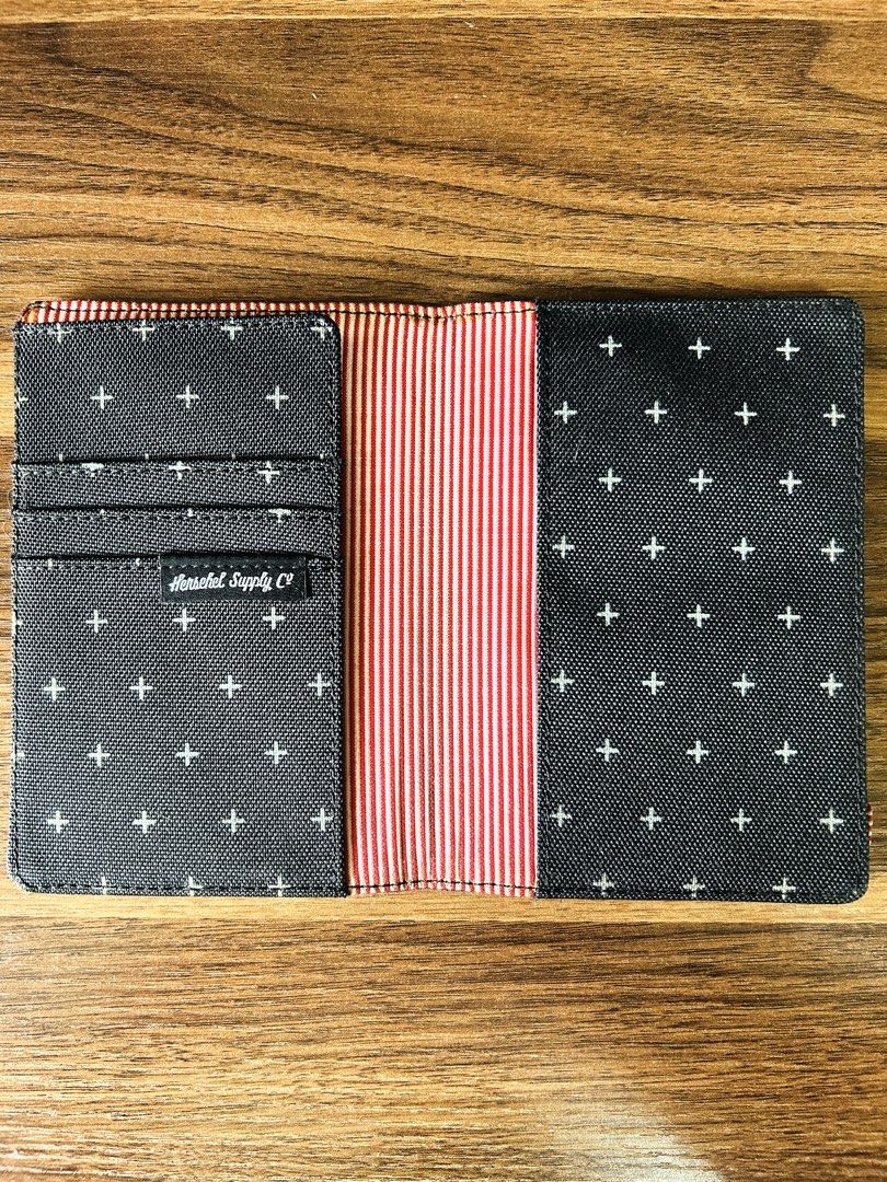 Herschel Supply Co. | Raynor RFID Passport Holder Cross Pattern (Category: Luxury Bags & Wallets) located in Makati City. Submitted by reese.stone (Listing ID 1465632673, Image 2). Description: - Herschel passport holder in dark grey with a white cross pattern all over. - Classic red and white striped interior lining. - Multiple card slots on the left side and slip pockets for passport storage. - Herschel logo tag on the front exterior and inside