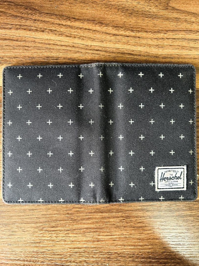 Herschel Supply Co. | Raynor RFID Passport Holder Cross Pattern (Category: Luxury Bags & Wallets) located in Makati City. Submitted by reese.stone (Listing ID 1465632673, Image 1). Description: - Herschel passport holder in dark grey with a white cross pattern all over. - Classic red and white striped interior lining. - Multiple card slots on the left side and slip pockets for passport storage. - Herschel logo tag on the front exterior and inside