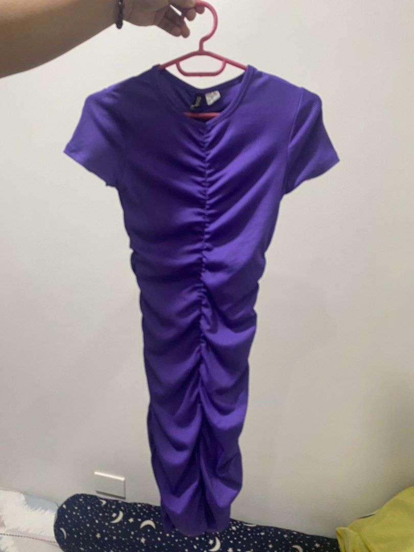 H&M Divided Purple Ribbed Top (Category: Dresses) located in Manila. Submitted by eunicemasi95239 (Listing ID 1465738722, Image 1). Description: - Brand/Line: Divided - Size: XS - Color: Bright purple - Material: Stretchy and comfortable ribbed fabric - Fit: Short sleeves, comfortable fit - Condition: Tag clearly visible - Style: Versatile everyday piece, easy to match with jeans or skirts.