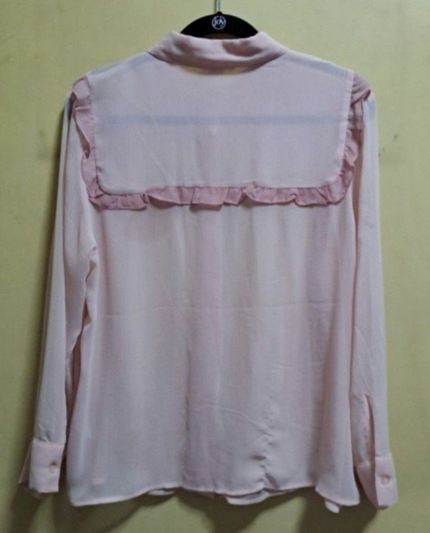 H&M Light Pink Sheer Blouse (Category: Blouses) located in Manila. Submitted by thrifter_lifestyle (Listing ID 1465691882, Image 2). Description: Brand: H&M Long-Sleeves Sheer light material, best to be worn with inner Photo of back included No issues, barely worn 😀 RFS: Shifted to WFH, no need for office/business clothes.