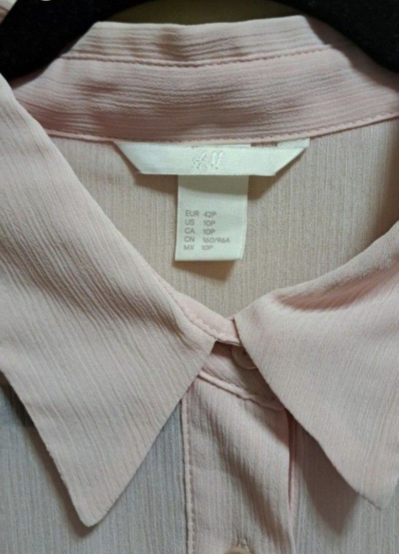 H&M Light Pink Sheer Blouse (Category: Blouses) located in Manila. Submitted by thrifter_lifestyle (Listing ID 1465691882, Image 3). Description: Brand: H&M Long-Sleeves Sheer light material, best to be worn with inner Photo of back included No issues, barely worn 😀 RFS: Shifted to WFH, no need for office/business clothes.