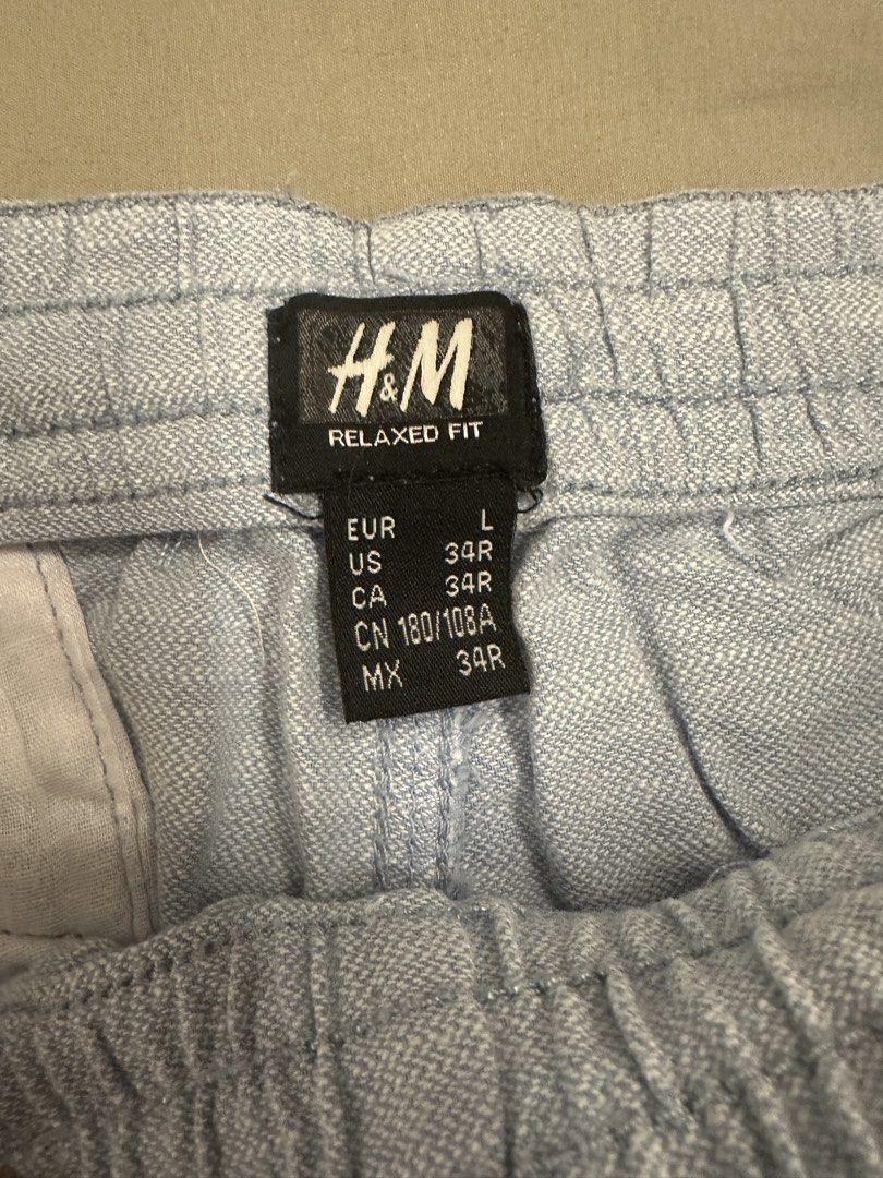 H&M Relaxed Fit Blue Drawstring Shorts (Category: Shorts) located in Cainta. Submitted by calcervshop (Listing ID 1465745651, Image 2). Description: - Brand: H&M - Style: Relaxed fit shorts in light blue - Comfort: Elasticated waistband with adjustable white drawstring - Storage: Two convenient side pockets - Perfect for: Casual everyday wear and easy matching with basic tees.