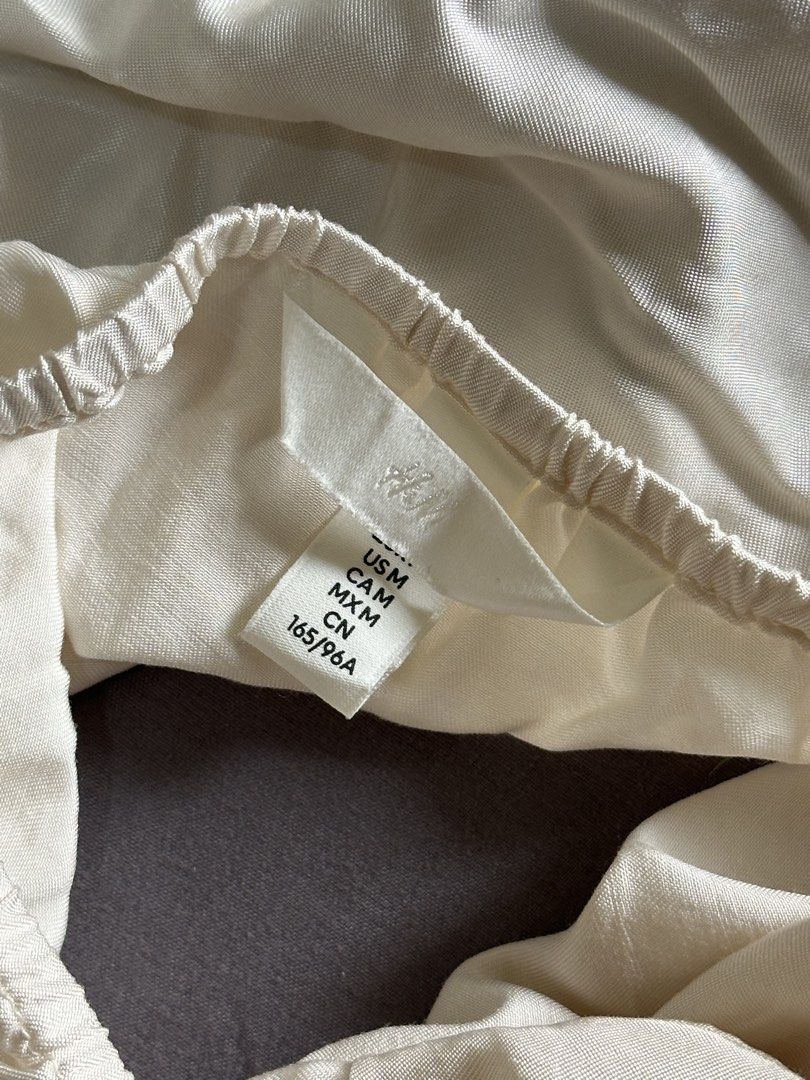 H&M White Satin Halter Top with Rhinestone Strap (Category: Sleeveless) located in Pasig City. Submitted by afterglowpreloved (Listing ID 1465596530, Image 3). Description: .