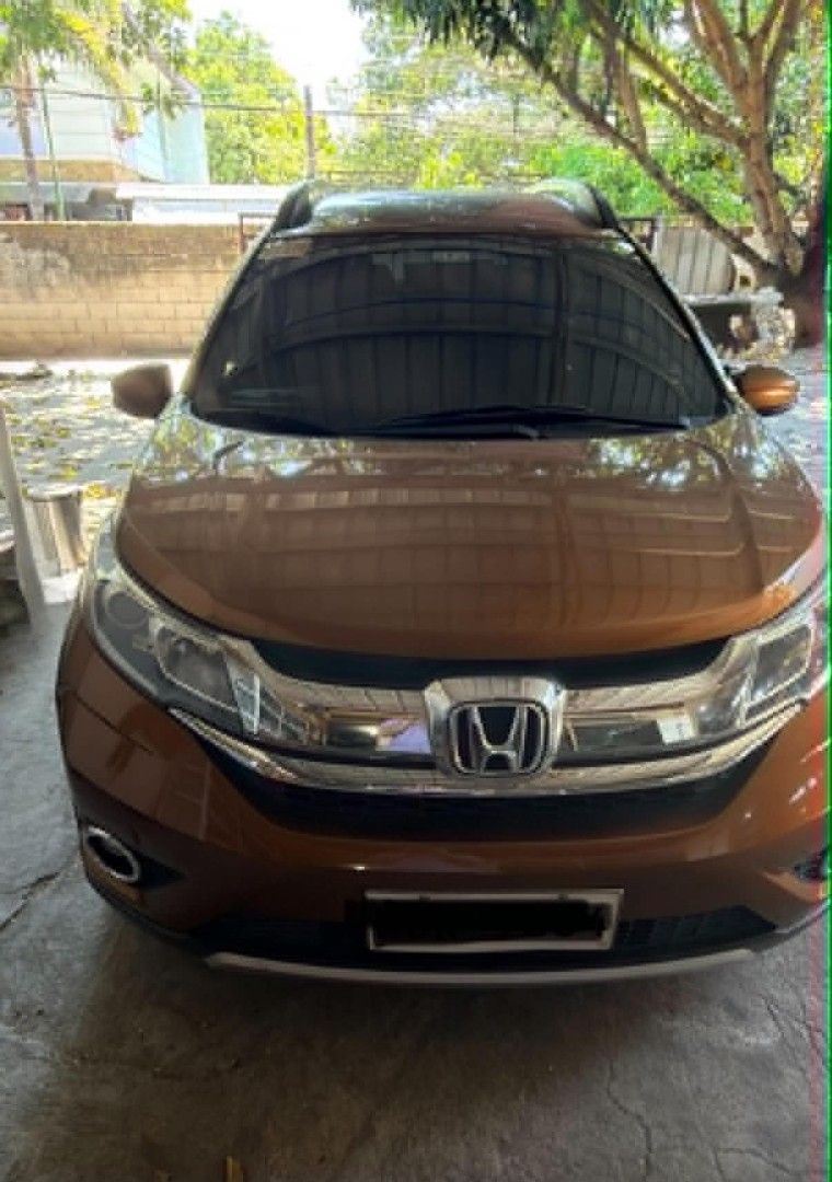 Honda BR-V (Category: Used Cars) located in Cavite. Submitted by yukiro_16 (Listing ID 1465642574, Image 1). Description: 2017 HONDA BR-V 1.5 NAVI CVT | Automatic | Gasoline * Color: Premium Amber * V Navi variant * 7-seater configuration * 1.5L i-VTEC engine * CVT automatic transmission * Navigation / touchscreen infotainment * Alloy wheels * Good condition * mileage: 38k Coding: Tuesday.