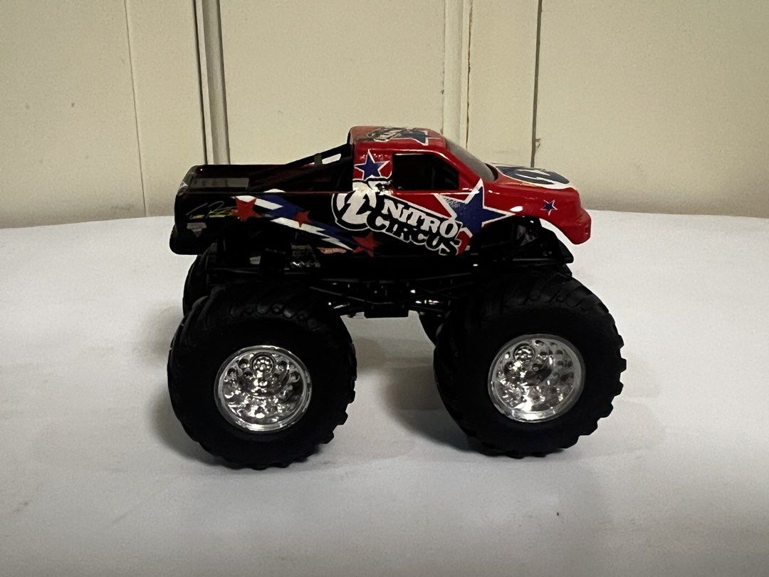 Hot Wheels Nitro Circus Monster Truck (Category: Vehicle & Diecast Models) located in Quezon City. Submitted by steve088 (Listing ID 1465666796, Image 2). Description: - Brand: Hot Wheels Nitro Circus - Design: Red and black body with blue and white star graphics - Wheels: Large chrome wheels with chunky black tires - Details: Iconic branding printed on sides and roof - Condition: Great addition for toy car collectors and monster truck fans Meetu