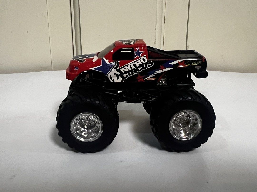 Hot Wheels Nitro Circus Monster Truck (Category: Vehicle & Diecast Models) located in Quezon City. Submitted by steve088 (Listing ID 1465666796, Image 3). Description: - Brand: Hot Wheels Nitro Circus - Design: Red and black body with blue and white star graphics - Wheels: Large chrome wheels with chunky black tires - Details: Iconic branding printed on sides and roof - Condition: Great addition for toy car collectors and monster truck fans Meetu