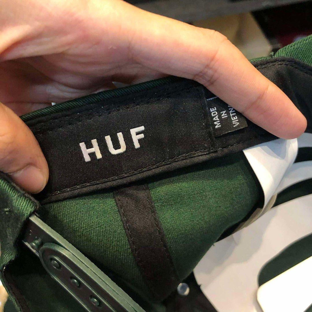 HUF Green Classic H Triple Triangle Snapback Hat (Category: Caps & Hats) located in General Trias. Submitted by km1120 (Listing ID 1465641043, Image 3). Description: - Brand: HUF - Style: Snapback Hat - Color: Dark green with white embroidered triple triangle logo - Material: 100% cotton - Condition: Brand new without tag, never worn, stored in plastic - Features: Adjustable strap at the back, inner tags fully intact.