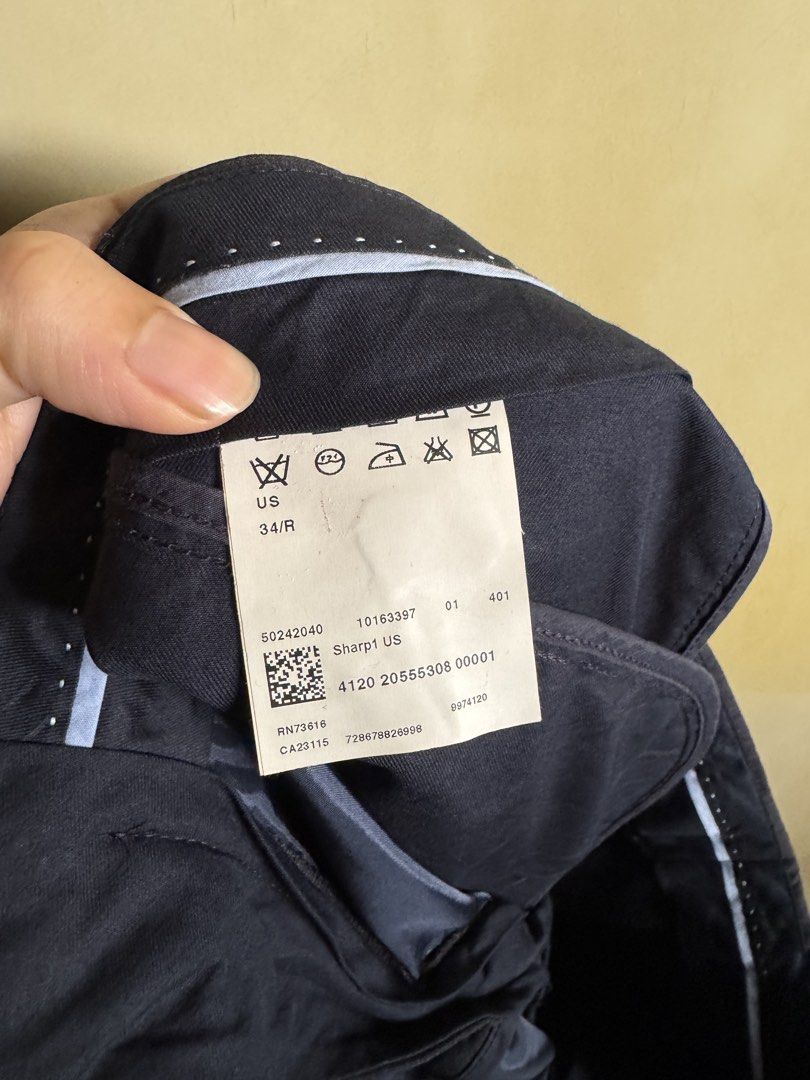 Hugo Boss Sharp1 US Trousers Size 34R Dark Navy (Category: Trousers) located in Manila. Submitted by seangoart (Listing ID 1465584407, Image 2). Description: - Brand: Hugo Boss - Model: Sharp1 - Color: Dark Navy Blue - Size: 34/R - Fit: Tailored fit - Details: Subtle micro-pattern texture, belt loops, buttoned back pocket, and chic polka dot interior waistband trim - Condition: Excellent, care label intact - Ideal for formal events, business meet