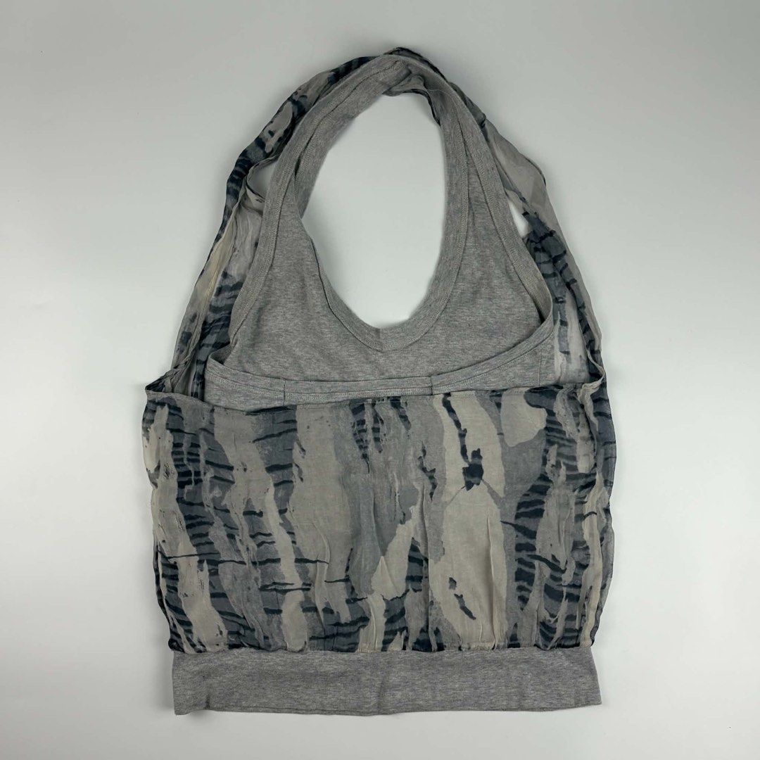 Hussein Chalayan - S/S 03 - Mesh Backless Halter Top (Category: Luxury Apparel) located in Bacolod City. Submitted by classy.glamour (Listing ID 1465735880, Image 2). Description: Hussein Chalayan - S/S 03 - Mesh Backless Halter Top Authentic Size: Small to Medium Condition: Good Flaw: Tear on mesh (see details pics) .