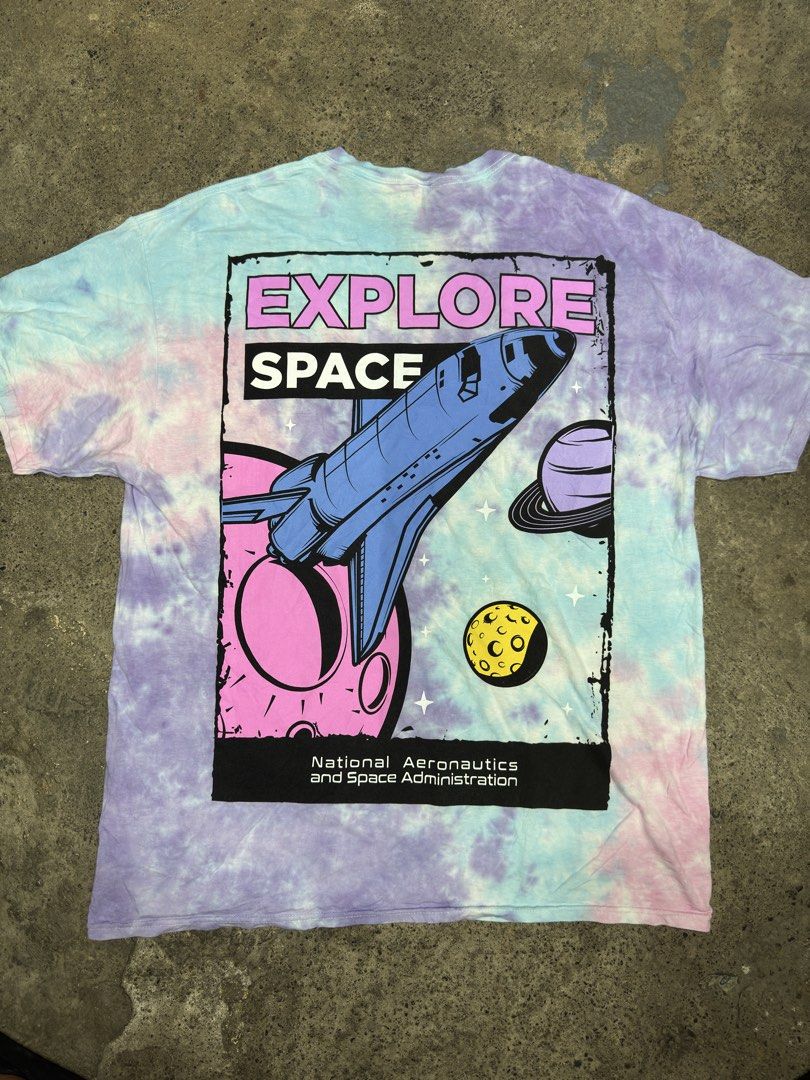 Hyper Space NASA Tie Dye T-Shirt Size 1X (Category: Tshirts & Polo Shirts ) located in Bustos. Submitted by thenlnclot60500 (Listing ID 1465595612, Image 1). Description: - Authentic NASA merchandise - Pastel tie-dye design (purple, blue, and pink) - Classic box logo on front chest - Large 'Explore Space' shuttle graphic on the back - 100% soft and breathable cotton - Size: 1X - Condition: Excellent/New.
